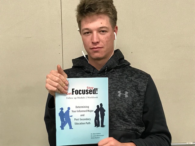 Success? Hunter Waasdorp, class of 18, poses with a Success workbook
Photo by Paige Lary