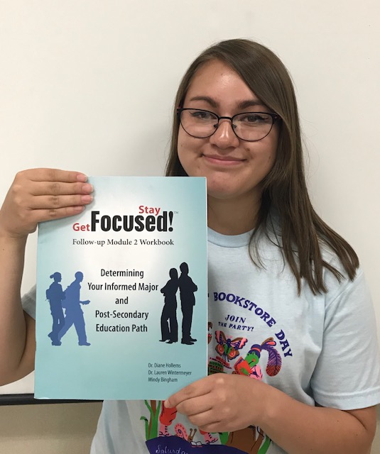 Get Focused! Grace Griego 18 poses with a Success workbook. Photo by Paige Lary