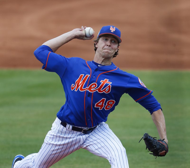 Jacob deGrom delivering a pitch. Photo by MLB
