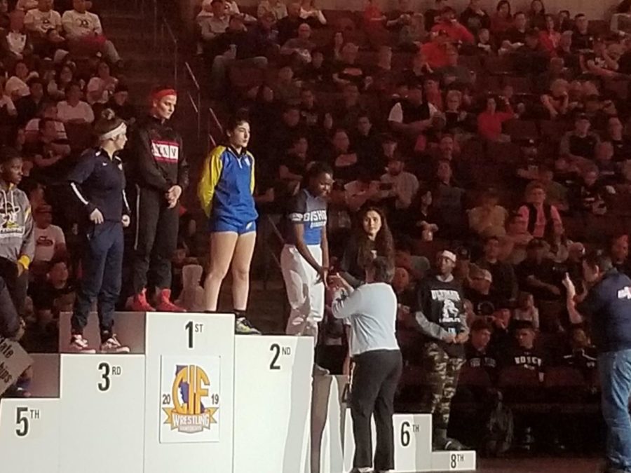 Tia receiving her 4th place medal.  Photo provided by Celia Mayhugh
