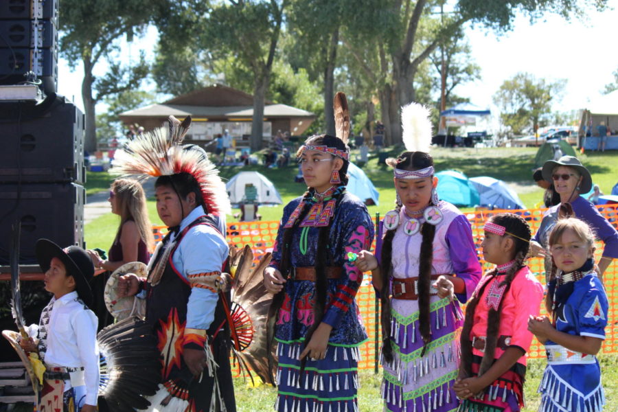 Powwow dance group getting ready to go on stage.