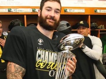 Hunter Kampmoyer holding the Rose Bowl Game trophy. Photos via Hunter Kampmoyers Instagram account 